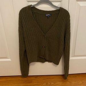 Green cardigan slightly cropped